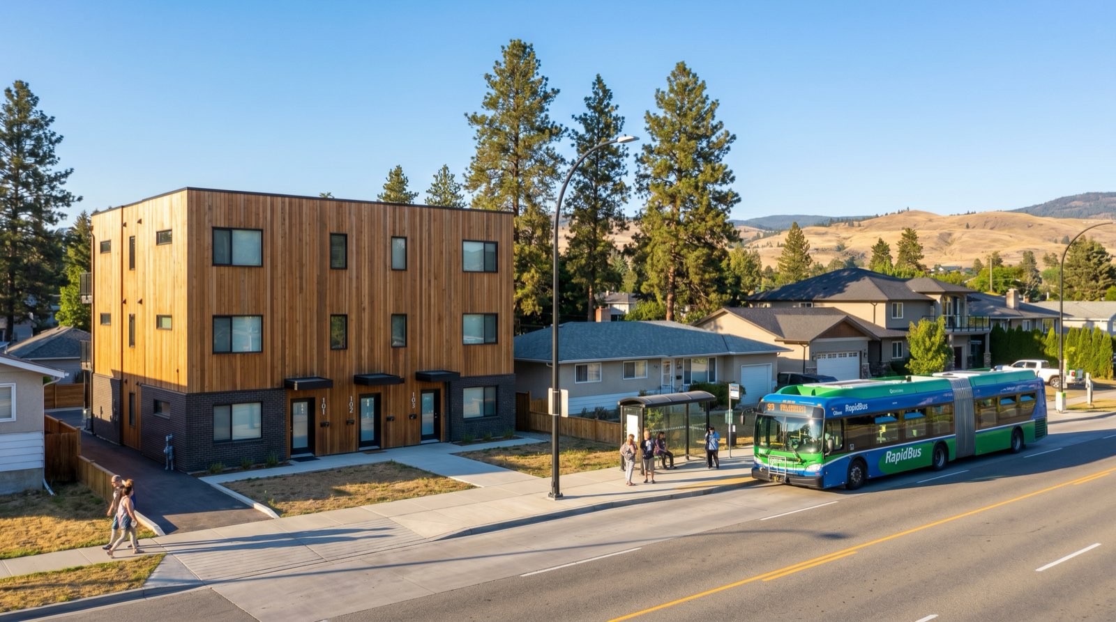 Rutland Kelowna streetscape along Highway 97 corridor with Route 97 RapidBus stop and SSMUH 6-unit multiplex overlay highlighting frequent transit 400 m zone